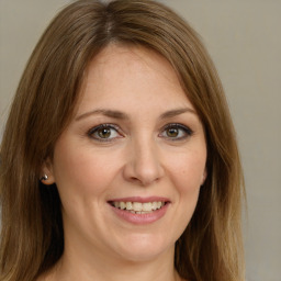 Joyful white young-adult female with medium  brown hair and green eyes