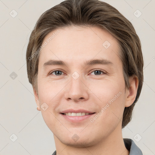 Joyful white young-adult female with short  brown hair and grey eyes