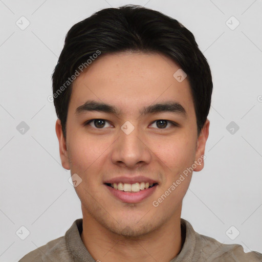 Joyful asian young-adult male with short  brown hair and brown eyes