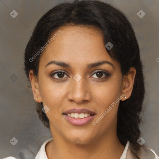 Joyful black young-adult female with medium  brown hair and brown eyes