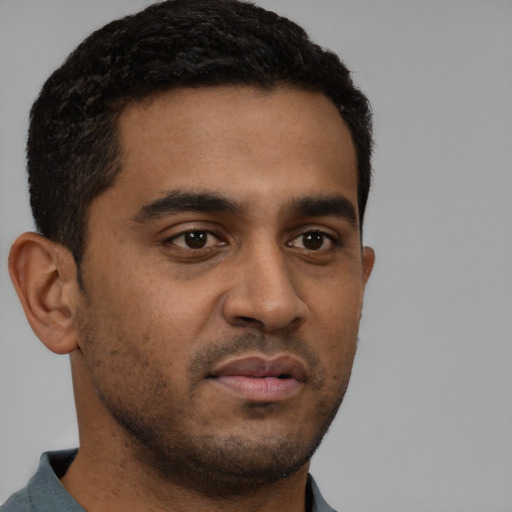 Neutral black young-adult male with short  brown hair and brown eyes