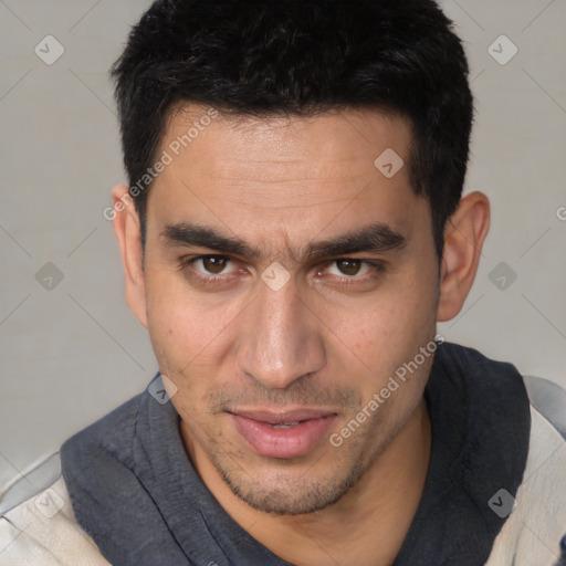 Joyful white adult male with short  brown hair and brown eyes