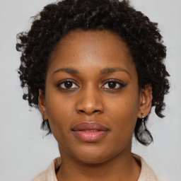 Neutral black young-adult female with short  brown hair and brown eyes