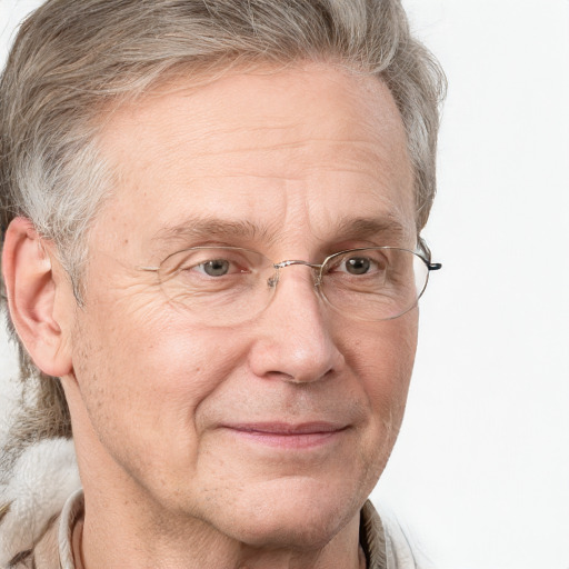 Joyful white middle-aged male with medium  brown hair and blue eyes