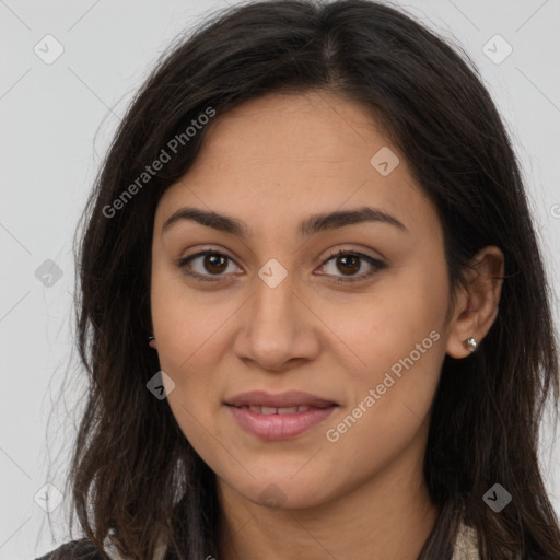 Joyful latino young-adult female with long  brown hair and brown eyes