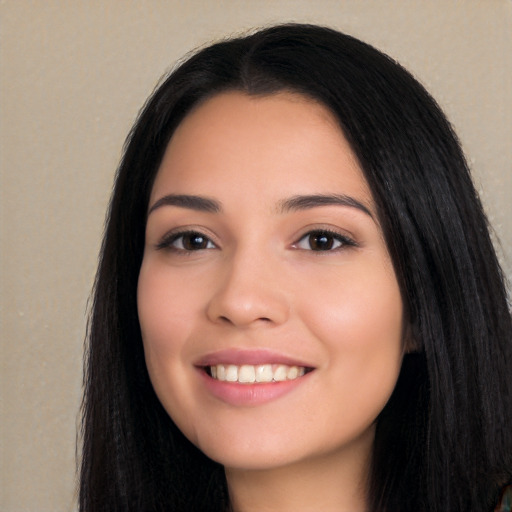 Joyful white young-adult female with long  black hair and brown eyes