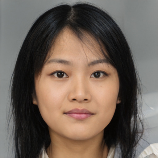 Neutral asian young-adult female with medium  brown hair and brown eyes