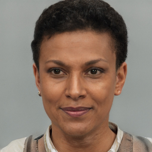 Joyful latino adult female with short  black hair and brown eyes