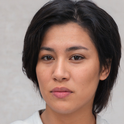 Neutral asian young-adult female with medium  brown hair and brown eyes