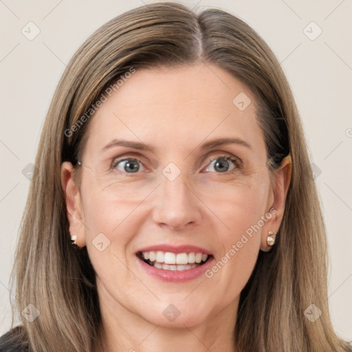 Joyful white young-adult female with long  brown hair and grey eyes