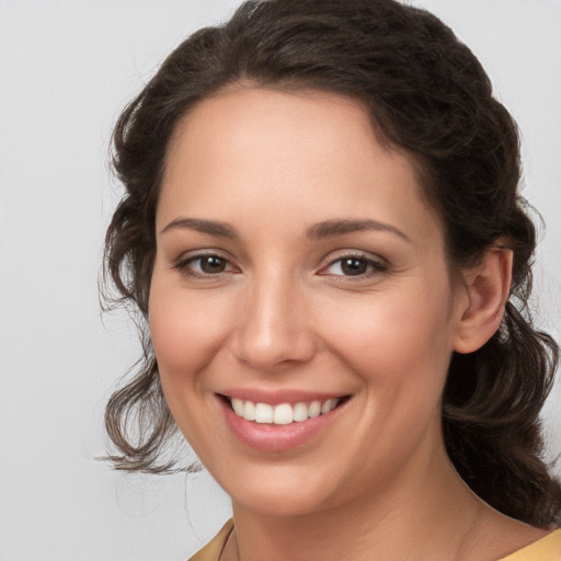 Joyful white young-adult female with medium  brown hair and brown eyes