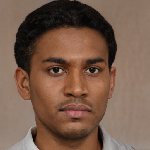 Neutral latino young-adult male with short  brown hair and brown eyes