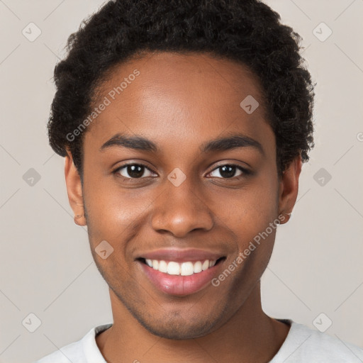 Joyful black young-adult male with short  brown hair and brown eyes