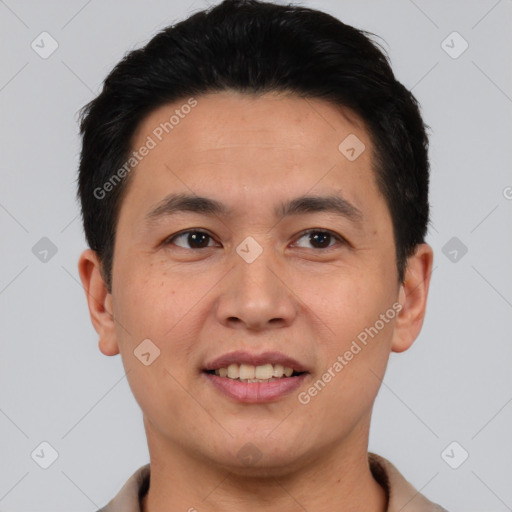 Joyful asian young-adult male with short  black hair and brown eyes