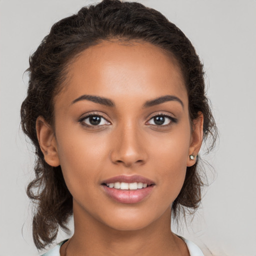 Joyful white young-adult female with medium  brown hair and brown eyes