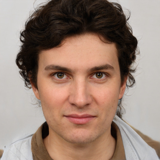 Joyful white young-adult male with medium  brown hair and brown eyes