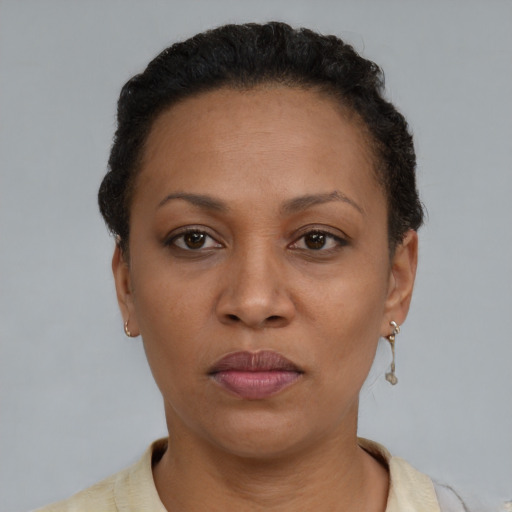 Neutral black adult female with short  brown hair and brown eyes