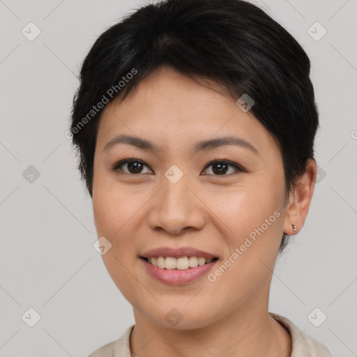 Joyful asian young-adult female with short  brown hair and brown eyes