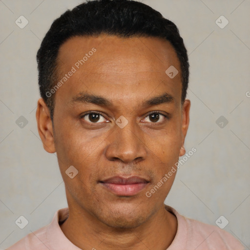 Joyful black young-adult male with short  black hair and brown eyes