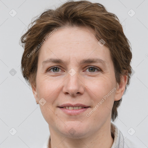 Joyful white adult female with short  brown hair and grey eyes