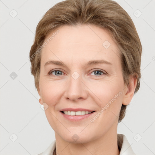 Joyful white adult female with short  brown hair and grey eyes