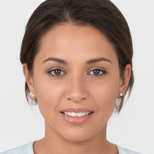 Joyful white young-adult female with medium  brown hair and brown eyes