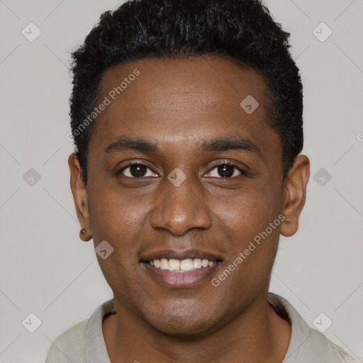 Joyful black young-adult male with short  black hair and brown eyes