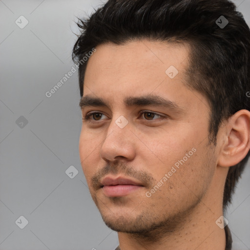 Neutral white young-adult male with short  black hair and brown eyes