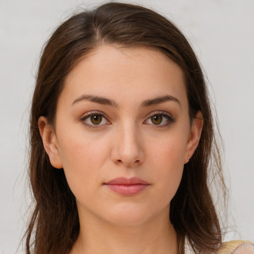 Neutral white young-adult female with long  brown hair and brown eyes