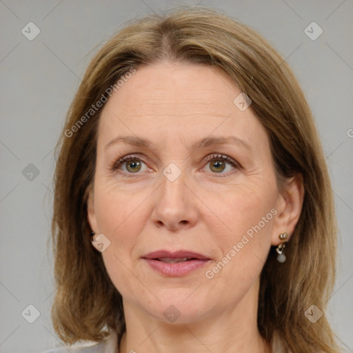 Joyful white adult female with medium  brown hair and brown eyes