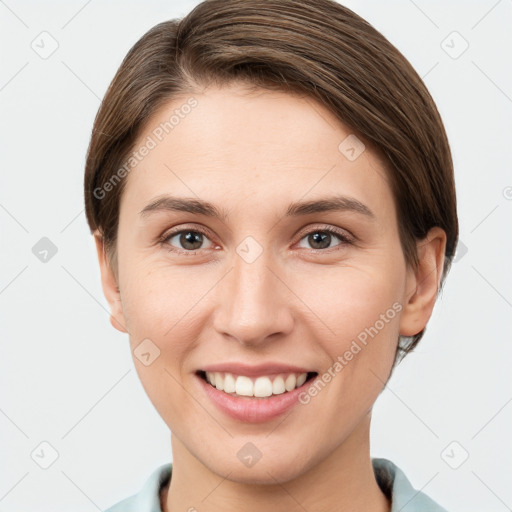 Joyful white young-adult female with short  brown hair and grey eyes