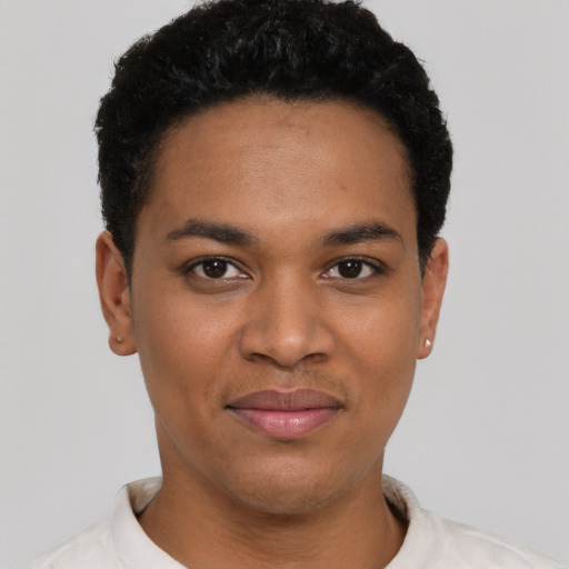 Joyful black young-adult female with short  black hair and brown eyes
