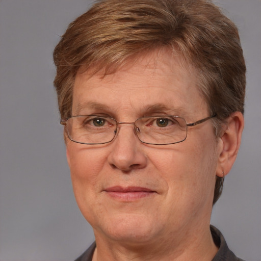 Joyful white middle-aged female with short  brown hair and blue eyes