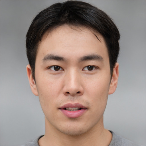 Neutral asian young-adult male with short  brown hair and brown eyes