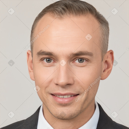 Joyful white adult male with short  brown hair and brown eyes