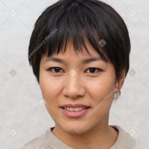 Joyful asian young-adult female with short  brown hair and brown eyes