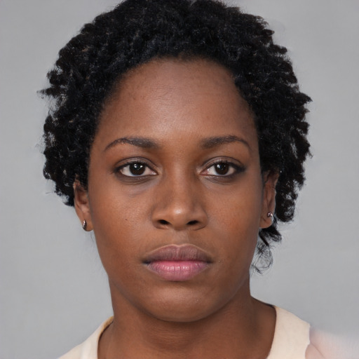 Neutral black young-adult female with short  black hair and brown eyes