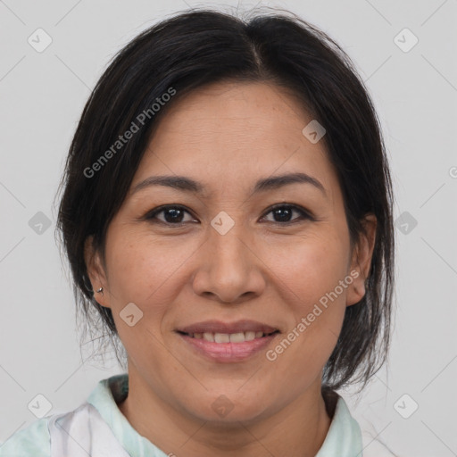 Joyful asian adult female with medium  brown hair and brown eyes