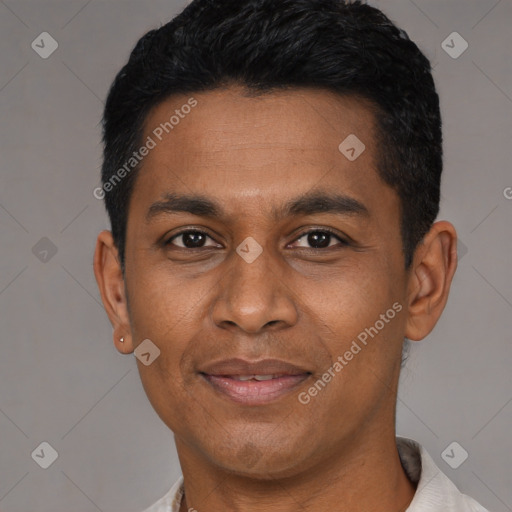 Joyful latino young-adult male with short  black hair and brown eyes