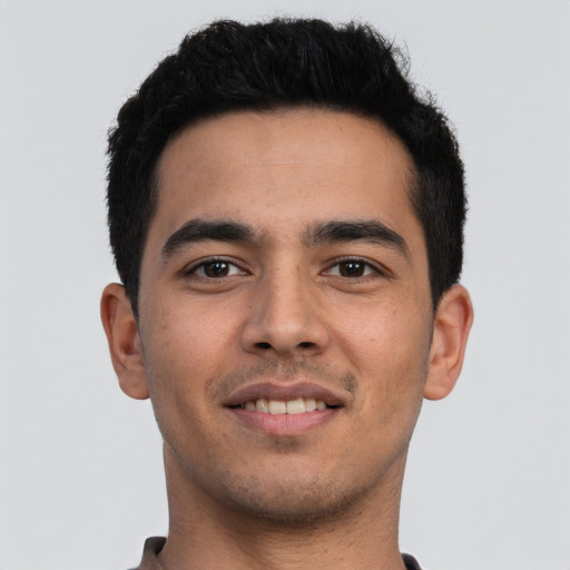 Joyful asian young-adult male with short  black hair and brown eyes