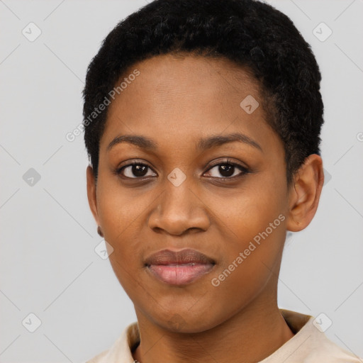 Joyful black young-adult female with short  black hair and brown eyes