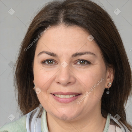 Joyful white adult female with medium  brown hair and brown eyes