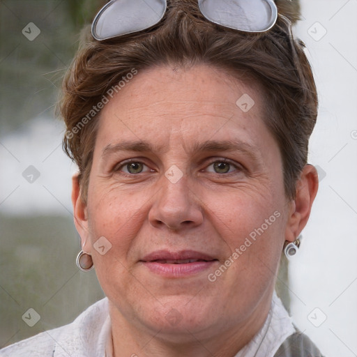 Joyful white adult female with short  brown hair and grey eyes