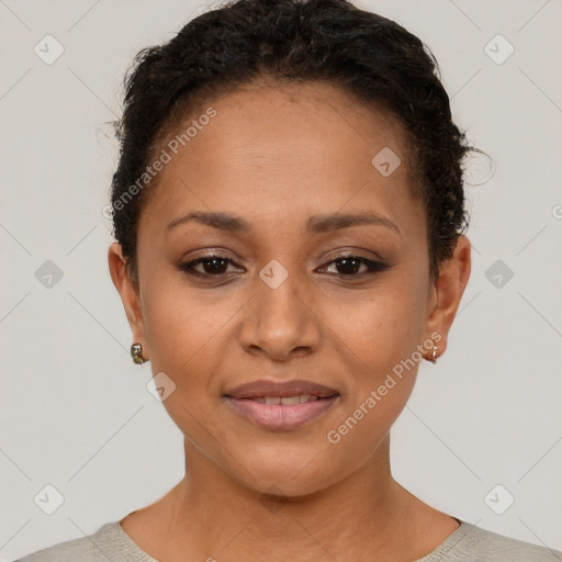Joyful black young-adult female with short  brown hair and brown eyes