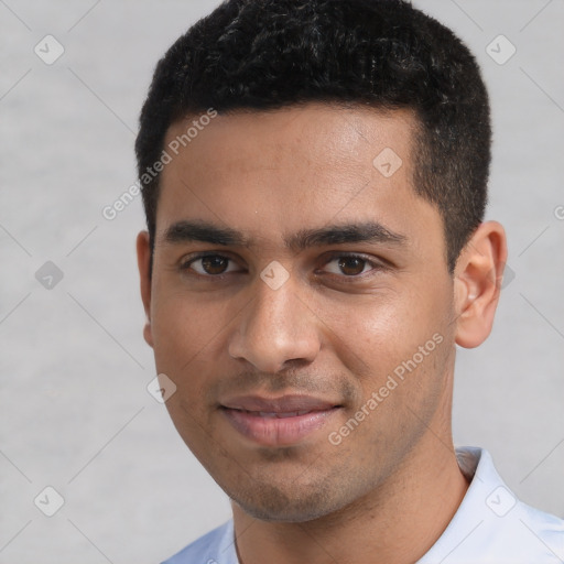 Joyful white young-adult male with short  black hair and brown eyes