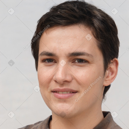 Joyful white young-adult female with short  brown hair and brown eyes