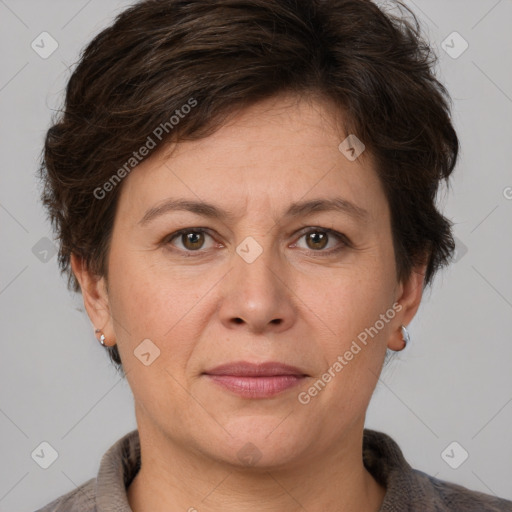 Joyful white adult female with short  brown hair and grey eyes