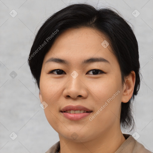 Joyful asian young-adult female with medium  brown hair and brown eyes