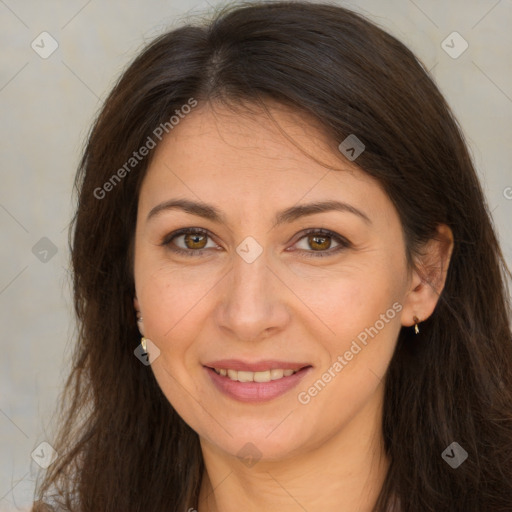 Joyful white adult female with long  brown hair and brown eyes