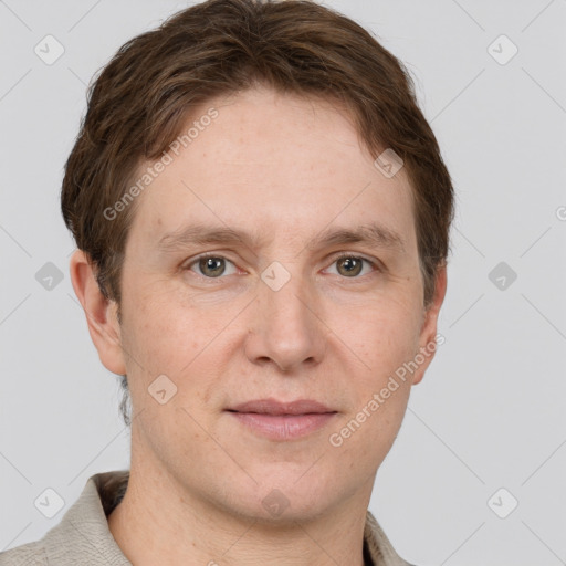 Joyful white adult male with short  brown hair and grey eyes